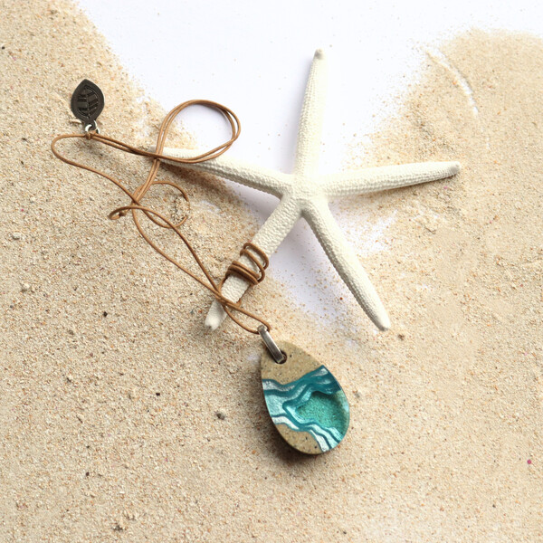 Small light blue resin pendant necklace