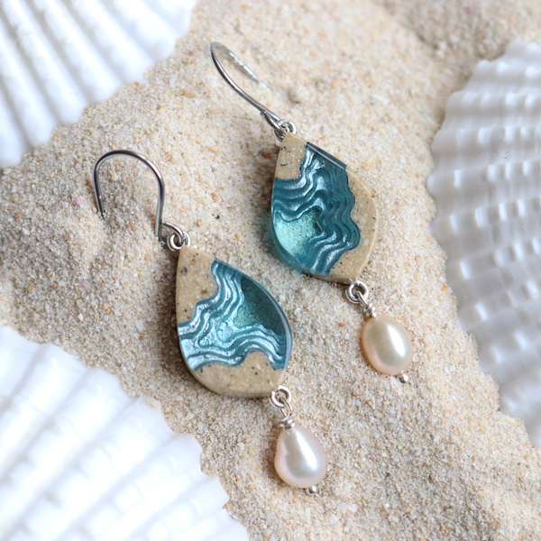 Bay small beach sand and pearl dangle earrings on sand