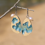 Rockpool large beach sand and blue resin dangle earrings on beach